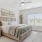 a bedroom with a bed and a fan