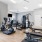The fitness center at River Rock at Blume Road homes for rent in Mooresville, NC, featuring wood grain floor paneling.