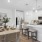 a kitchen with a dining table and chairs