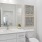 a bathroom with a sink toilet and mirror