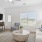 a living room with a tv and couches
