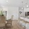 a kitchen with white cabinets