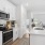 a kitchen with white cabinets