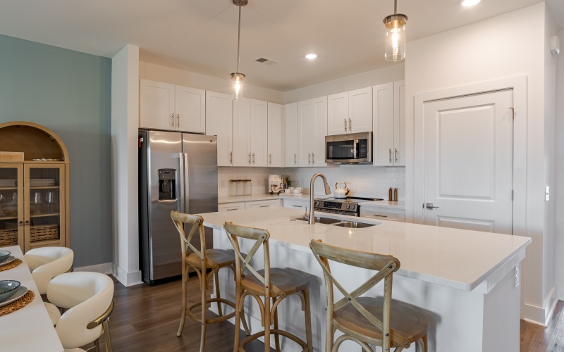 a kitchen with white cabinets