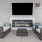 Resident lounge at River Rock at Blume Road homes for rent in Mooresville, NC, featuring couches and a flat screen TV.