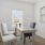 a room with a table and chairs