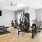 The fitness center at River Rock at Blume Road homes for rent in Mooresville, NC, featuring wood grain floor paneling.