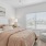 a bedroom with a bed and a chair