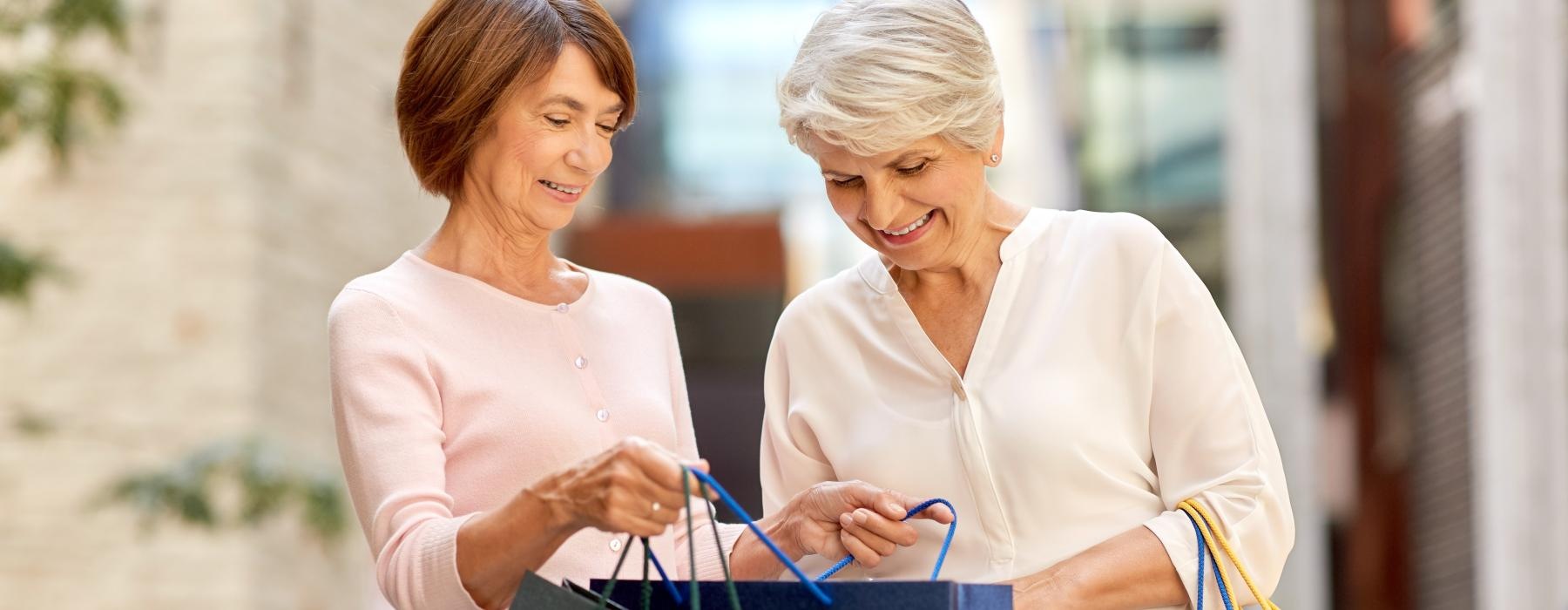 two women holding shopping bags