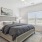 a bedroom with a bed and a lamp