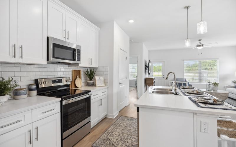 a kitchen with white cabinets